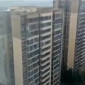 Kids playing on top of a highrise