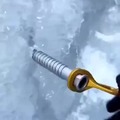 Using an ice screw to source water whilst ice climbing